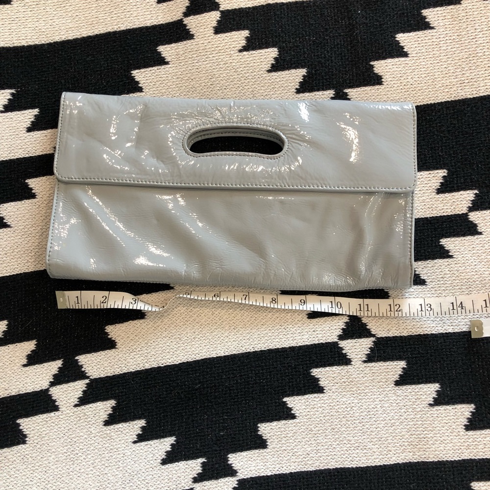 Gray patent leather clutch by Hobo